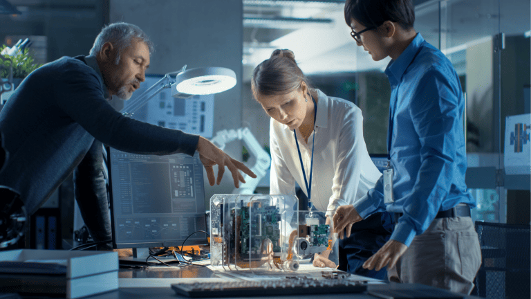 People looking at a hologram 3D product