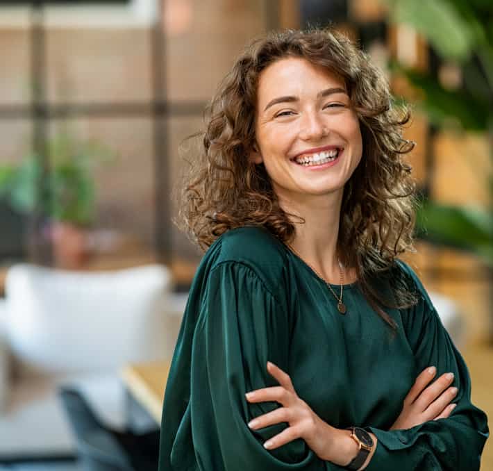 happy female with hands crossed