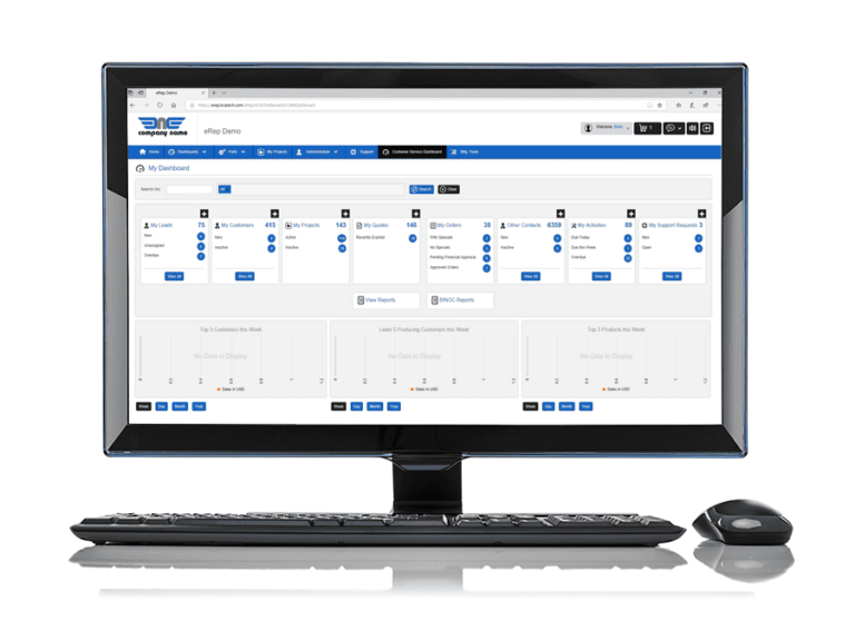 A computer monitor showcases an eRep for Manufacturers software dashboard, brimming with various information cards. A keyboard and mouse are neatly positioned in front of the screen.