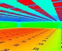 Abstract image with rows of colored rectangles in red, orange, and blue, creating a perspective illusion. Numerical markings, possibly calculated with ElumTools precision, are visible on the orange surface.