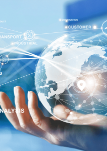 A hand holds a holographic globe showcasing interconnected icons, depicting elements of supply chain management like logistics, transport, and analysis against a blurred blue background.