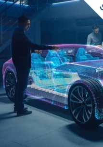 In the dimly lit room, a person engages with a digital hologram of a car, initiating the Beginning of the Idea-to-Cash Journey, while two others observe attentively. Labeled Step 1, this moment marks the first stride toward transforming concepts into reality.