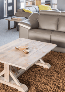 coffee table in front of a leather couch