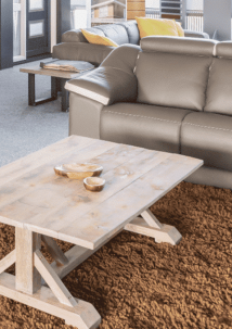 coffee table in front of a leather couch